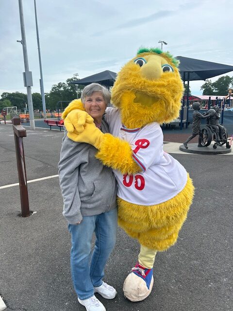 Getting some love from Buster, mascot of the Jersey Shore BlueClaws.